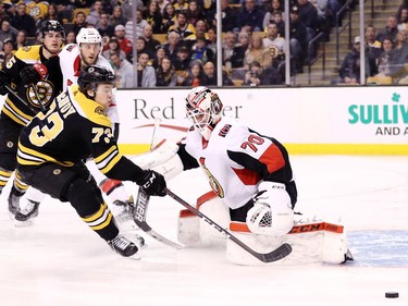 Charlie McAvoy of the Bruins takes a shot against Senators netminder Danny Taylor during the third period.