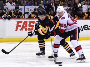 Max McCormick of the Senators skates with the puck against Olli Maatta of the Pittsburgh Penguins.