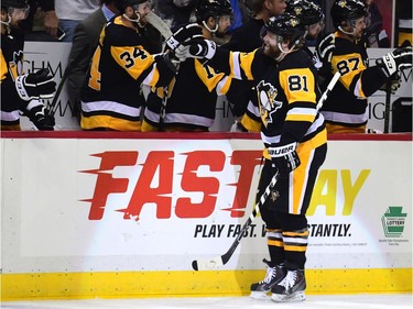 Phil Kessel of the Penguins receives congratulations from teammates after scoring a goal against the Senators in the third period.