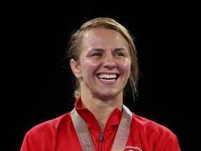 Erica Wiebe of Stittsville displays a gold-medal smile during the medal ceremony for the women's freestyle wrestling 76-kilogram division of the Commonwealth Games in Australia on Thursday. Scott Barbour/Getty Images