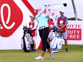 Brooke Henderson of Smiths Falls hits driver off the first tee during the fourth round of the LPGA LOTTE Championship on Saturday.