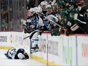 ST PAUL, MN - APRIL 15: Tyler Myers #57 of the Winnipeg Jets lays on the ice during the second period in Game Three of the Western Conference First Round against the Minnesota Wild during the 2018 NHL Stanley Cup Playoffs at Xcel Energy Center on April 15, 2018 in St Paul, Minnesota. (Photo by Hannah Foslien/Getty Images)
