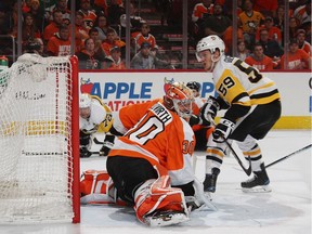 Jake Guentzel #59 of the Pittsburgh Penguins scores his fouth goal of the game against Michal Neuvirth #30 of the Philadelphia Flyers in Game Six of the Eastern Conference First Round during the 2018 NHL Stanley Cup Playoffs at the Wells Fargo Center on April 22, 2018 in Philadelphia, Pennsylvania. The Penguins defeated the Flyers 8-5 to win the series 4-2.
