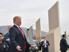 US President Donald Trump inspects border wall prototypes in San Diego, California on March 13, 2018.