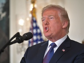 TOPSHOT - US President Donald Trump addresses the nation on the situation in Syria April 13, 2018 at the White House in Washington, DC. Trump said strikes on Syria are under way.
