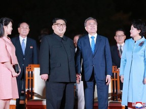 This picture taken on April 27, 2018 and released from North Korea's official Korean Central News Agency (KCNA) on April 28, 2018 shows North Korea's leader Kim Jong Un (2nd L) and his wife Ri Sol Ju (L) attending a farewell ceremony with South Korea's President Moon Jae-in (2R) and his wife Kim Jung-sook (R) at the end of their historic summit at the truce village of Panmunjom. North Korea on April 28 hailed its summit with the South as a "historic meeting" that paved the way for the start of a new era, after the two leaders pledged to pursue a permanent peace and rid the peninsula of nuclear weapons.