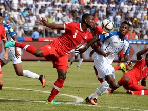 Honduras' Romell Quioto (2nd-R) vies for the ball with Canada's Doneil Henry (L) during their 2018 FIFA World Cup qualifiers football match in the Olimpico Metropolitano stadium in San Pedro Sula, Honduras on September 2, 2016.