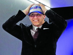 Wyoming's Josh Allen walks on to the stage after being selected seventh overall by the Buffalo Bills during the first round of the NFL football draft, Thursday, April 26, 2018, in Arlington, Texas. (AP Photo/David J. Phillip)
