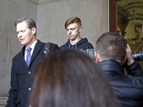 Ethan Couch, right, is released from Tarrant County Corrections Department in Fort Worth, Texas as his attorney is interviewed Monday, April 2, 2018.