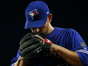 Toronto Blue Jays starting pitcher Marco Estrada walks off the field after being relieved in the fifth inning against the Baltimore Orioles, Wednesday, April 11, 2018, in Baltimore. (AP Photo/Patrick Semansky)