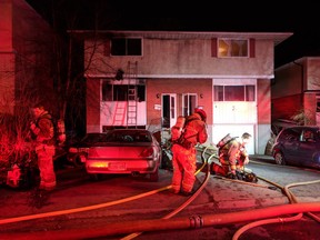 Ottawa firefighters battle fire in Brittania bungalow early Tuesday. Three residents were displaced, three pet dogs perished.