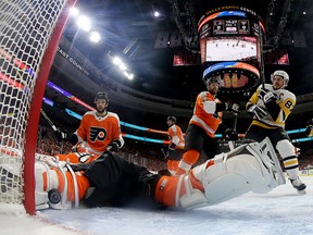 Brian Elliott of the Philadelphia Flyers is unable to stop a shot from Evgeni Malkin of the Pittsburgh Penguins at Wells Fargo Center on April 18, 2018 in Philadelphia. (Elsa/Getty Images)