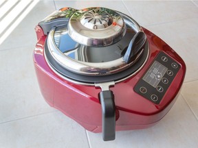 Food blogger Lu Yang demonstrating a recipe with the Ropot, a made-in-Ottawa cooking appliance.