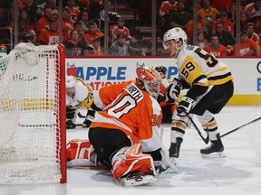Pittsburgh Penguins forward Jake Guentzel scores his fouth goal of the game against Flyers goalie Michal Neuvirth during Game 6 in Philadelphia on Sunday. (Bruce Bennett/Getty Images)