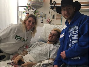 Hockey legend Hayley Wickenheiser (left) and country music star Paul Brandt (right) visited Humboldt Broncos Ryan Straschnitzki in Saskatoon hospital as Straschnitzki continued to recover following the April 6, 2018 highway collision in which 16 people on the Broncos team bus died (Photo courtesy Ryan Straschnitzki)