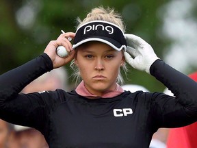 Brooke Henderson adjusts her visor at the first hole during the 2017 CP Women's Open on Aug. 24, 2017