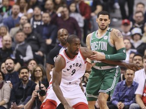 Raptors forward Serge Ibaka carries the ball agaisnt the Boston Celtics on Wednesday night at the Air Canada Centre. (Veronica Henri/Toronto Sun)