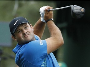 Patrick Reed hits a drive on the 18th hole during the third round pf the Masters on Saturday.