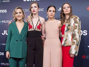 Jordan Miller, second right, stands with her "The Beaches" as they arrive at the Juno Awards in Vancouver, Sunday, March, 25, 2018. The closest singer and guitarist Jordan Miller gets to courtship these days is mingling with fellow singletons on Tinder while she tours North America.
