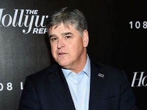 FILE - In this April 12, 2018 file photo, Fox News personality Sean Hannity attends The Hollywood Reporter's annual 35 Most Powerful People in Media event in New York. Hannity is President Donald Trump's most vocal defender on television, and a week ago he was on the air criticizing the FBI raid on the president's personal attorney Michael Cohen as evidence that Special Counsel Robert Mueller's "witch hunt" against the president has become a runaway train. It was revealed in a court hearing Monday, April 16, that Cohen also represented Hannity.