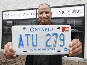 Yogi Sharma poses with his plate in Ottawa Monday April 16, 2018. Sharma is an assistant business agent with the ATU and a former bus driver with OC Transpo. He has a personalized licence plate that says ATU 279, which is the name of the local for bus operators. However, for years now, he has coveted a plate that says just ATU. It belongs to a bus driver and former union guy, Michel David, who died in December. Yogi has been trying to take  over the plate since neither Michel, his widow or family want it. But MTO has these rules that make it very hard to transfer a personal plate to anyone other than family.