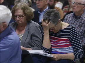 North Gower resident Jacqueline Leger (hand on head) holds her head at the Alfred Taylor Recreation Centre in North Gower Monday April 23, 2018.