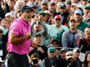 Patrick Reed reacts after winning the Masters golf tournament Sunday, April 8, 2018, in Augusta, Ga. (AP Photo/Charlie Riedel)