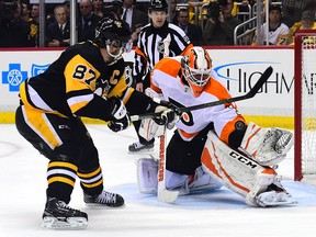 Brian Elliott of the Philadelphia Flyers makes a save on Sidney Crosby of the Pittsburgh Penguins at PPG PAINTS Arena on April 13, 2018 in Pittsburgh. (Matt Kincaid/Getty Images)