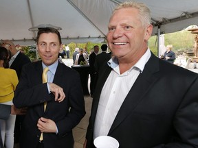 Then Ontario PC leader Patrick Brown (left) is welcomed at a reception by Doug Ford at the Ford family house in Toronto on May 14, 2015. (Michael Peake/Toronto Sun)