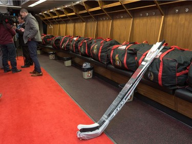 A group of reporters wait for interviews in an empty locker room as the Ottawa Senators clear out their lockers and have their exit meetings with coaches and management at Canadian Tire Centre following the final game of the season on Saturday. Photo by Wayne Cuddington/ Postmedia