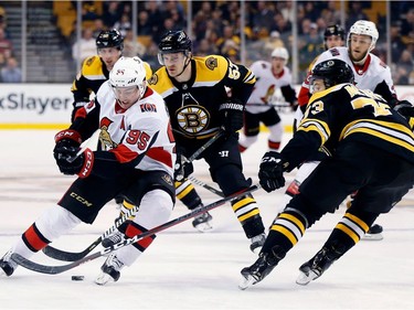 Ottawa's Matt Duchene (95) loses control of the puck against Boston's Charlie McAvoy during the third period of Saturday's game in Boston.