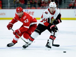 Ottawa Senators center Jean-Gabriel Pageau (44) is pursued by Detroit Red Wings left wing Darren Helm (43) during the third period of an NHL hockey game Saturday, March 31, 2018, in Detroit.