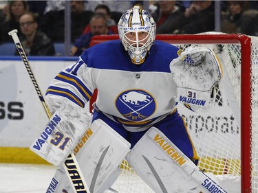 Buffalo Sabres goalie Chad Johnson watches players during the second period of the team's NHL hockey game against the Ottawa Senators on Wednesday, April 4, 2018, in Buffalo, N.Y.