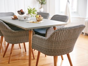 Bringing some of your outdoor furniture inside and pairing a light table with driftwood-coloured rattan chairs can help create a springlike feeling.