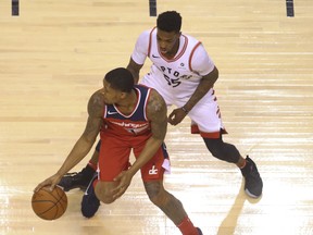 Washington Wizards Bradley Beal G (3) against Toronto Raptors Delon Wright PG (55) in the second quarter in Toronto, Ont. on Wednesday April 25, 2018. Jack Boland/Toronto Sun/Postmedia Network