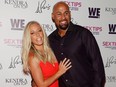 Kendra Wilkinson (L) and Hank Baskett arrive at the premiere celebration for WE tv's "Kendra on Top" and "Sex Tips for Straight Women from a Gay Man" on June 8, 2017 in Las Vegas. (Isaac Brekken/Getty Images for WE tv)