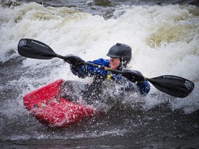 Happy paddlers were lining up along the Ottawa River at Bate Island as the surfable river wave has shown up for the spring time water enthusiasts. Julie Senecal was one of many excited kayakers to get out on the wave Sunday April 29, 2018.