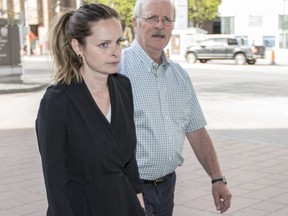 Kyla Cowan-Wilson, left in black, arrives to the Ottawa Courthouse Friday, May 18, 2018.