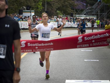 Gabriela Rocha was the first woman to cross the finish line in the half marathon May 27, 2018 at Ottawa Race Weekend.    Ashley Fraser/Postmedia