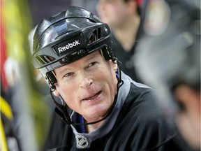 Jim Kyte chats on the bench with other Ottawa Senators alumni members during practice before an outdoor game on Parliament Hill in December. Julie Oliver/Postmedia