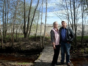 Snowbirds Lorraine and Larry St. Denis came home to Greely from Florida recently to find a mountain of dirt had landed behind their backyard.