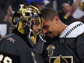 Vegas Golden Knights' Marc-Andre Fleury (left) and Ryan Reaves celebrate after winning Game 3 on Wednesday night. (GETTY IMAGES)