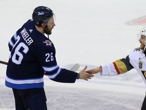 Winnipeg Jets captain Blake Wheeler (left) and Vegas Golden Knights centre Jonathan Marchessault shakes hands after Vegas won the Western Conference final on Sunday. (KEVIN KING/Postmedia Network)