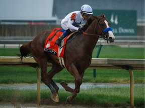 Justify #7, ridden by jockey Mike Smith runs down the stretch on his way to winning the 144th running of the Kentucky Derby at Churchill Downs on May 5, 2018 in Louisville, Kentucky.