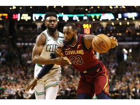 LeBron James #23 of the Cleveland Cavaliers handles the ball against Jaylen Brown #7 of the Boston Celtics in the first half during Game Two of the 2018 NBA Eastern Conference Finals at TD Garden on May 15, 2018 in Boston, Massachusetts.