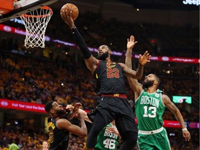 LeBron James #23 of the Cleveland Cavaliers shoots the ball against Marcus Morris #13 of the Boston Celtics in the first half during Game Three of the 2018 NBA Eastern Conference Finals at Quicken Loans Arena on May 19, 2018 in Cleveland, Ohio.