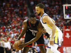 James Harden of the Rockets prepares for a drive to the hoop against the Warriors during Game 5 of the NBA Western Conference final in Houston on Thursday night.