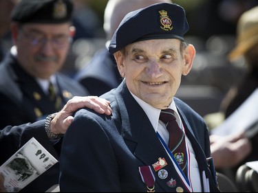 The Anniversary of the Battle of the Atlantic Ceremony to commemorate the sacrifices made by thousands of Canadians who fought in the North Atlantic took place in Ottawa Sunday May 6, 2018, at the National War Memorial. Captain Paul Bender, guest of honour from the Merchant Navy speaks to a friend Sunday. 

Ashley Fraser/Postmedia