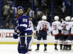 Tampa Bay Lightning right wing Nikita Kucherov leaves the ice as the Washington Capitals celebrate their 6-2 win during Game 2. (AP Photo/Chris O'Meara)