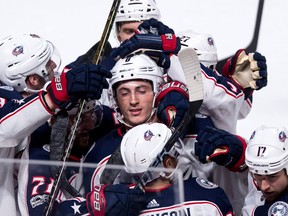 A group of Columbus Blue Jackets players celebrate a goal on Nov. 14, 2017 (Carson Meyer is not pictured)